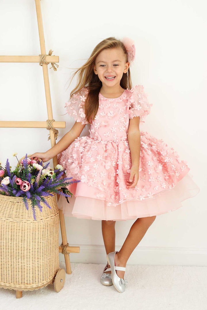 A pink floral dance dress that has 3D flowers, balloon arm and grainy tulle layers inside the skirt