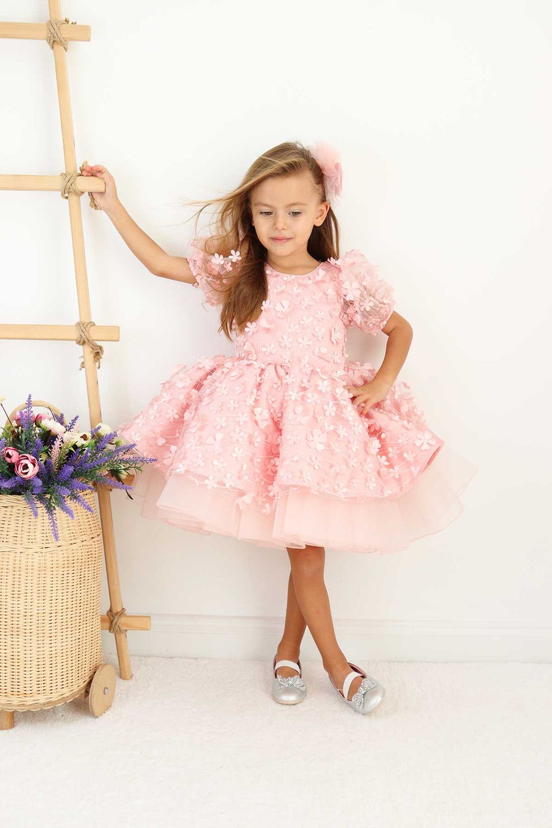 A pink floral dance dress that has 3D flowers, balloon arm and grainy tulle layers inside the skirt