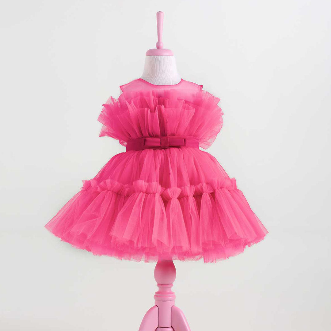 Hot pink tulle tutu dress with a full layered skirt and satin bow