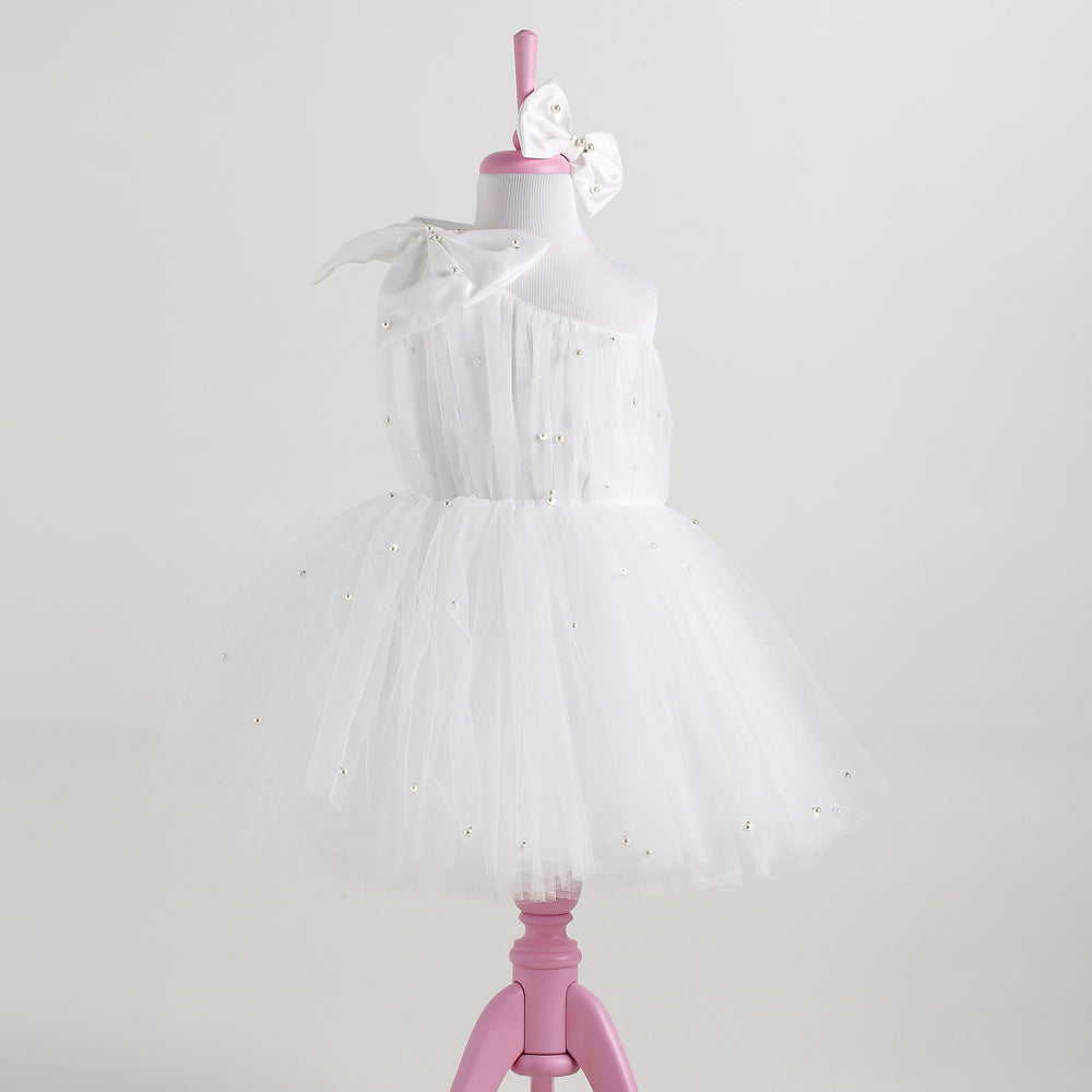Cindy white one-shoulder pearl tutu dress, a winter first birthday outfit idea