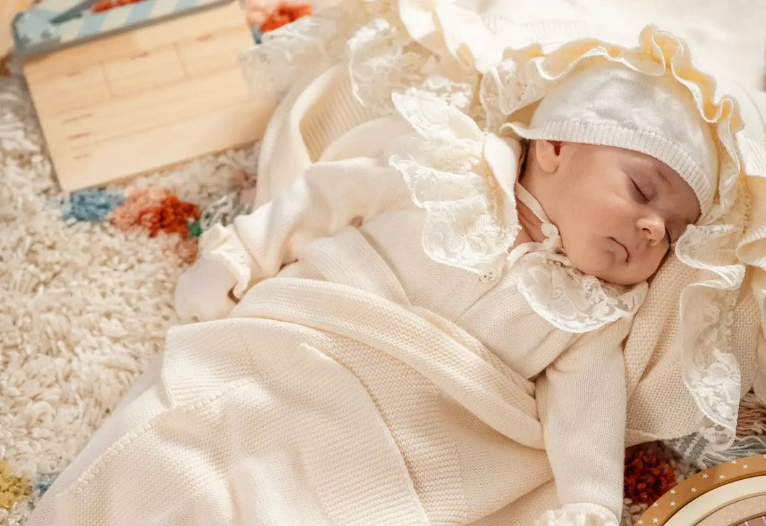 A newborn baby wearing home coming set.
