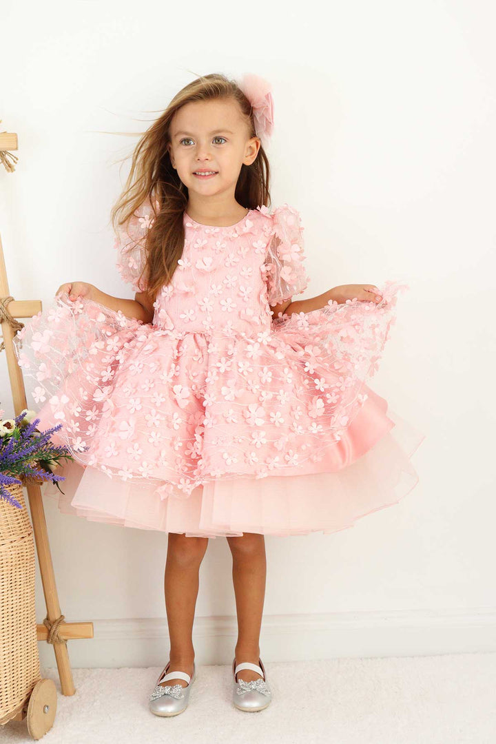 A pink floral dance dress that has 3D flowers, balloon arm and grainy tulle layers inside the skirt