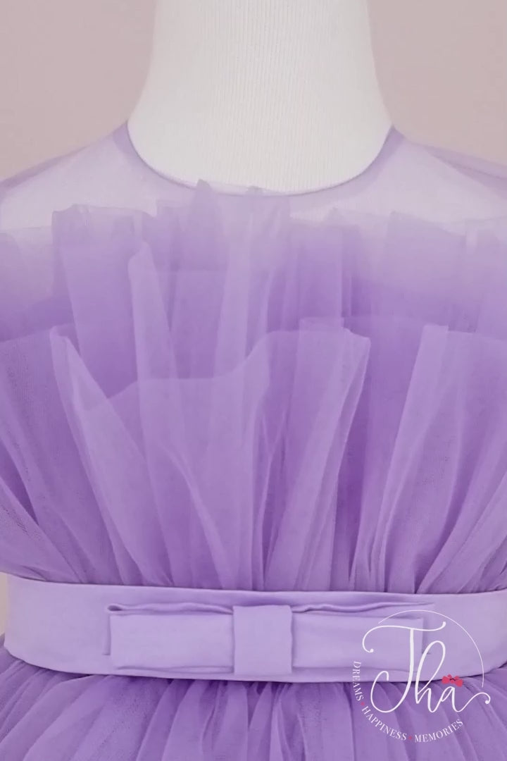 360° view of a lilac sleeveless tutu princess dress that has knee length fluffy multi layered skirt, belt, and lilac illusion collar