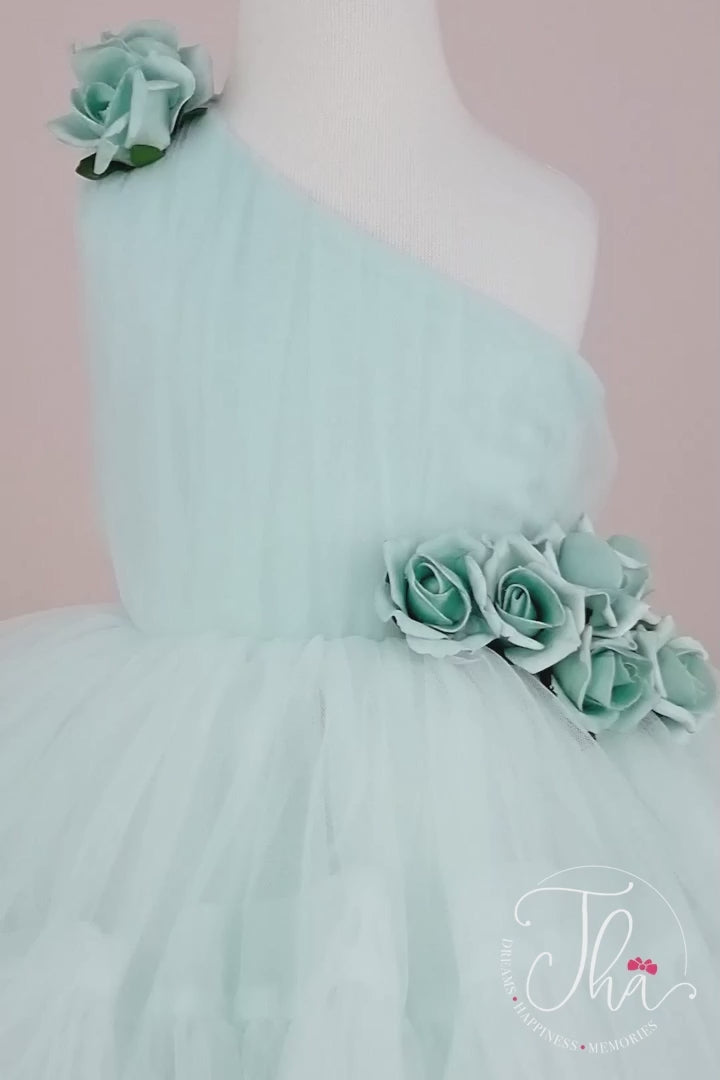 360° view of a tiffany one shoulder open sleeveless summer fairy dress that has knee length shirred skirt and 3D flowers