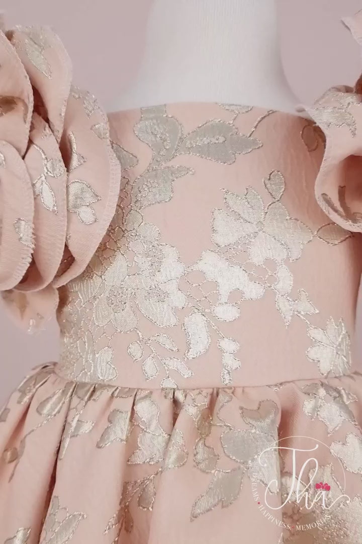 360° view of a powder flower concept powder dress that has brocade fabric, 3D floral gold print, 3D flowers on shoulders, boat collar, and knee length skirt