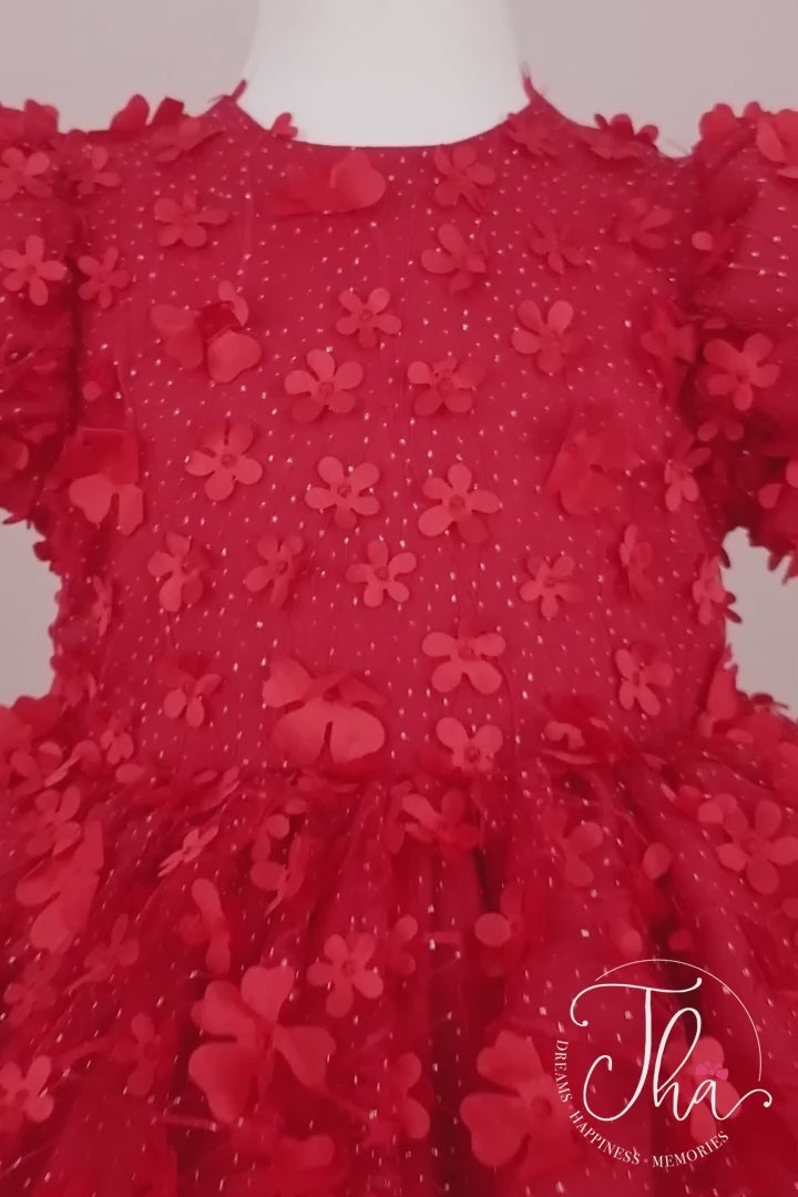 360° view of a red floral designer dress that has 3D flowers, balloon arm and multi layered skirt