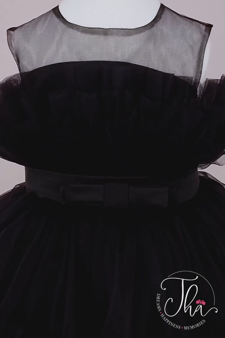 360° view of a black sleeveless tutu princess dress that has knee length fluffy multi layered skirt, belt, and black illusion collar