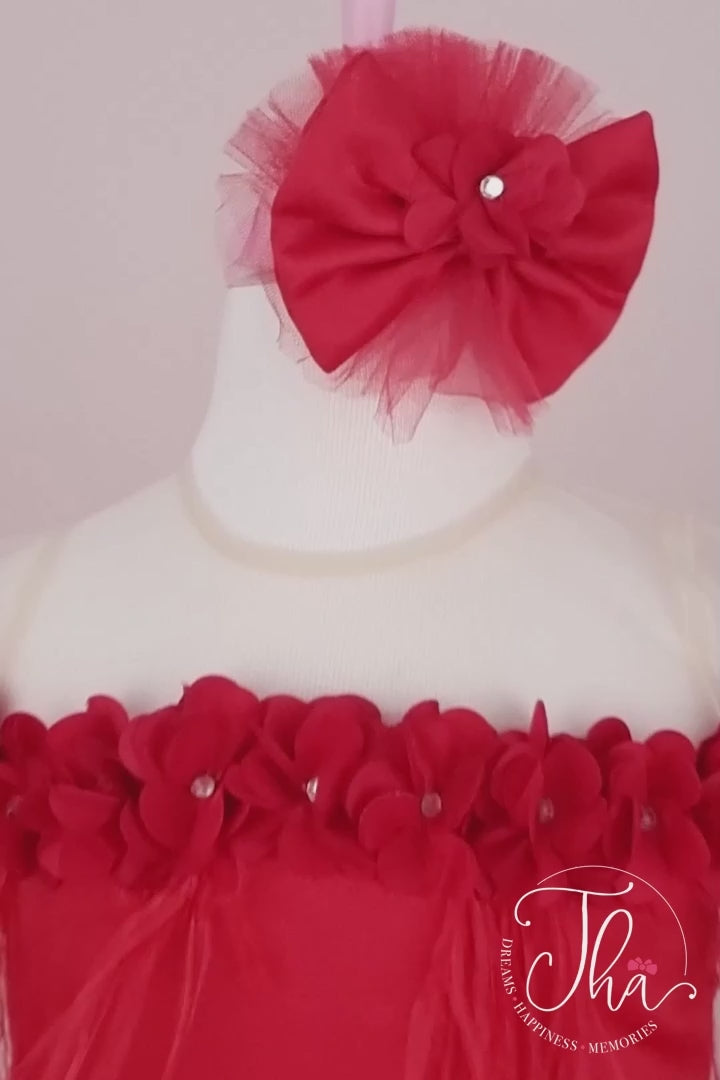 360° view of a red sleeveless stage dress that has 3D flowers with rhinestones, cap sleeve, feathers, illusion collar, satin top, and short skirt and long tail(train)