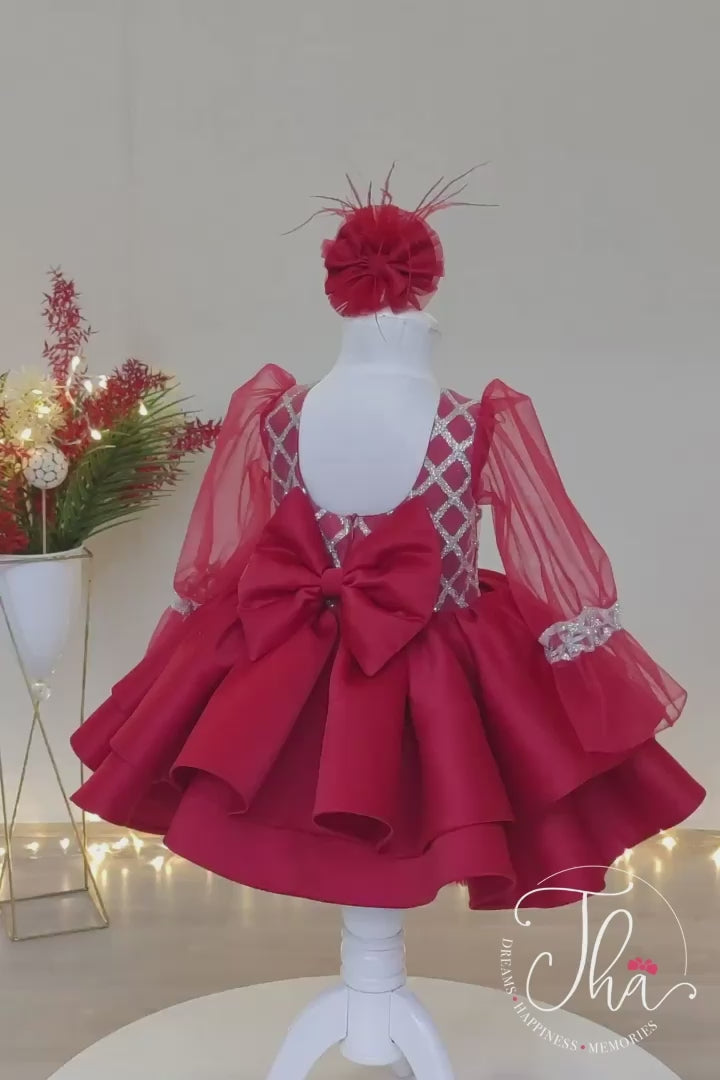 360° view of a red full sleeve diamond glitter pattern Christmas dress that has red skirt, satin top, tulle sleeve design, and bow