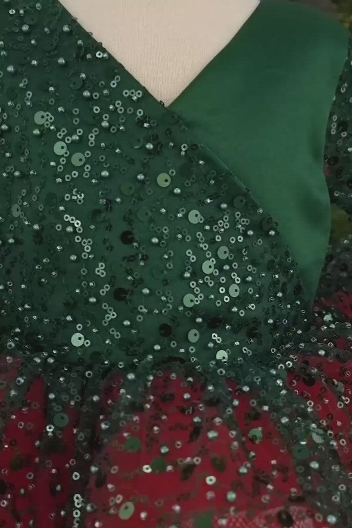 360° view of a full sleeve Christmas dress that has green sequin fabric on top of satin top, red skirt, and V-neck