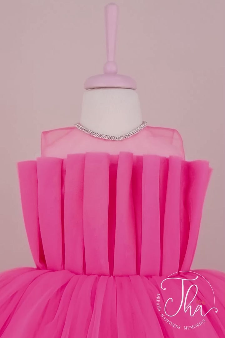 360° view of a hot pink sleeveless birthday party dress that has puffy hi-low skirt and illusion crystal stone decorated collar