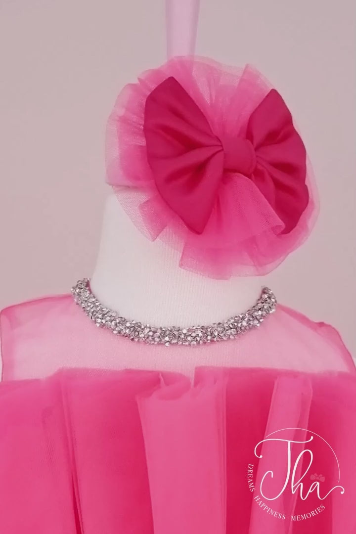 360° view of a hot pink sleeveless first birthday party dress that has puffy skirt and illusion crystal stone decorated collar