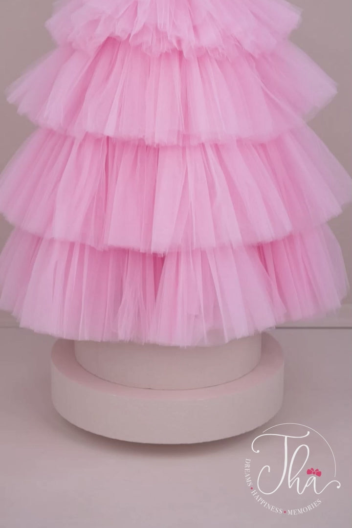360° view of a pink princess wedding dress. The dress has floor length skirt, satin top, and feathers on chest