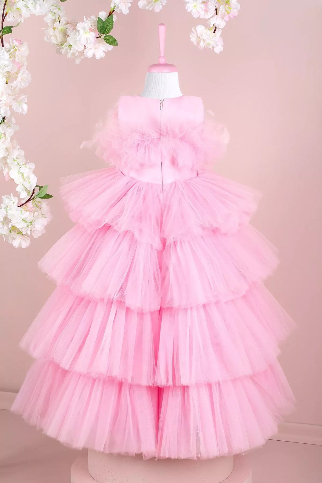 Back view of a pink princess wedding dress. The dress has floor length skirt and satin top
