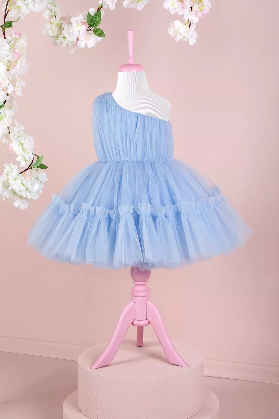 A baby blue one shoulder open sleeveless Smurf concept dress that has knee length shirred skirt