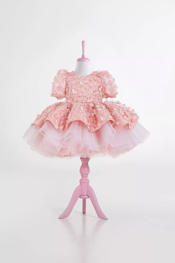 A pink floral dance dress that has 3D flowers, balloon arm and grainy tulle layers inside the skirt and Easter decorations