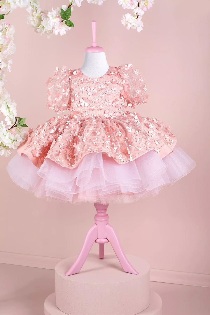 A pink floral dance dress that has 3D flowers, balloon arm and grainy tulle layers inside the skirt