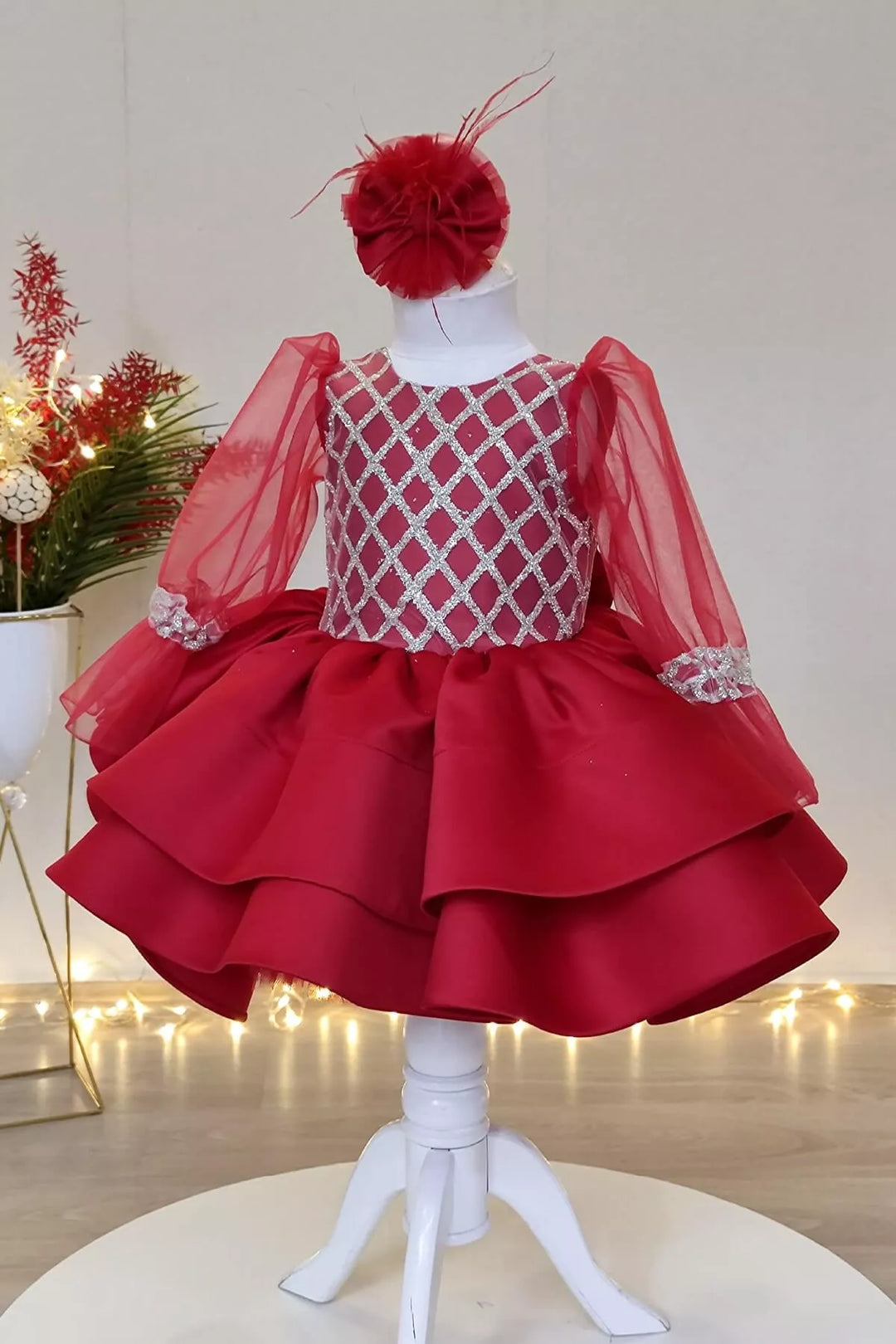 A red full sleeve diamond glitter pattern Christmas dress that has red skirt, satin top, and tulle sleeve design