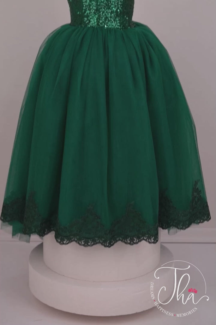 360° view of emerald green floor length bridesmaid dress that has green sequin top, one shoulder design and French lace on hems